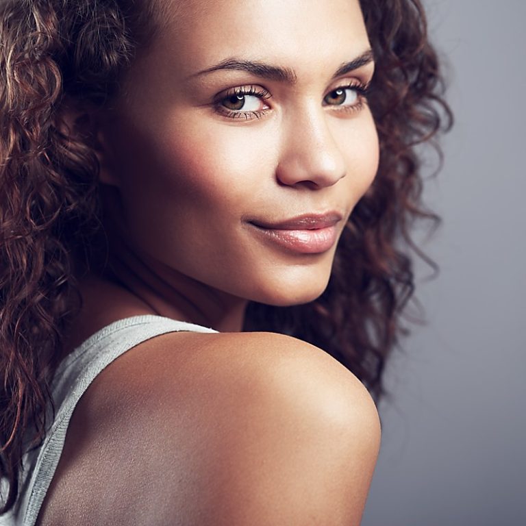 A beautiful african american woman modeling in a studio shoot